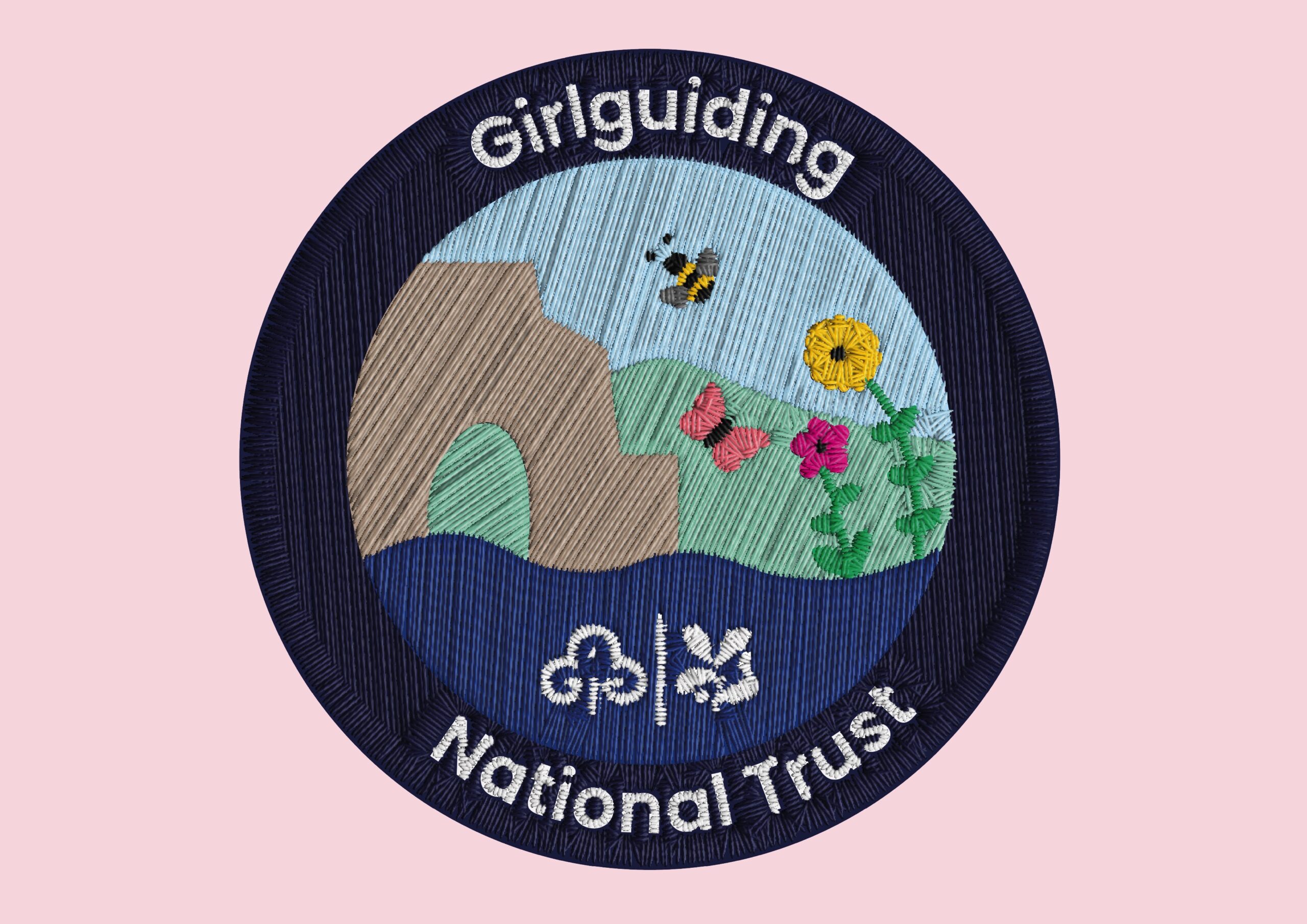 The badge design which is an illustration that represents the National Trust, showing the coast, a historic arch, flowers and insects. Then it has type around the which says Girlguiding National Trust.