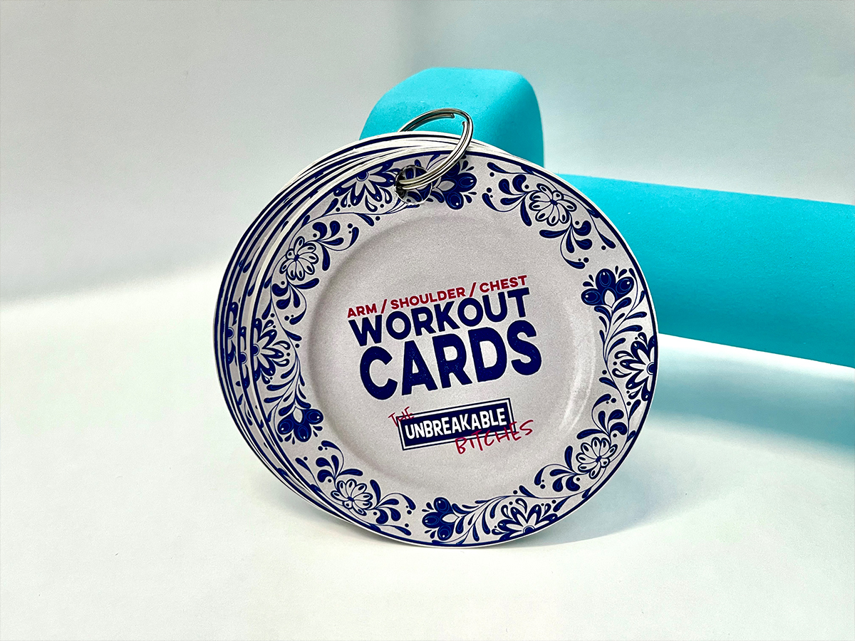 Workout cards resting on a dumbell.