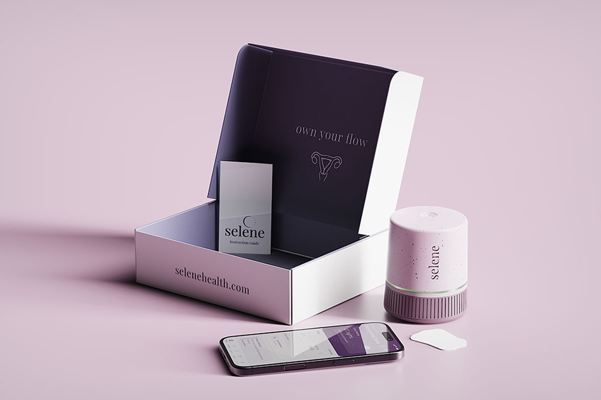 a box of packaging containing the device, an instruction manual, liner assays and a phone with the app on its screen. The box reads "own your flow" with a uterus illustration below. The fromt of the box reads selenehealth.com